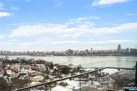 a view of a city with a lake