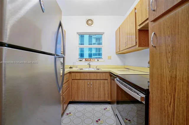 a utility room with a sink a washer and dryer