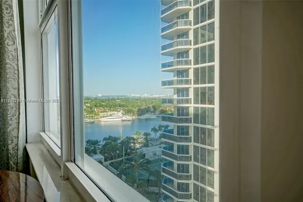 a view of a glass door and a window