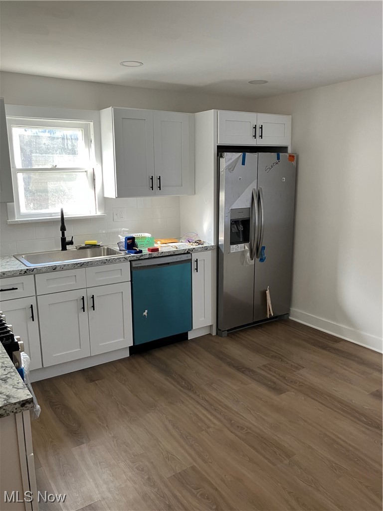 1058 Pembrook Road Cleveland Heights, OH 44121 - Photo 13 of 39 Kitchen featuring fridge, white cabinets, dishwasher, and dark wood finished floors