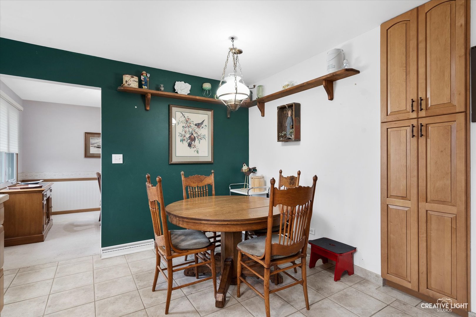 979 Ruth Drive Elgin, IL 60123 - Photo 12 of 26 a view of a dining room with furniture and a chandelier