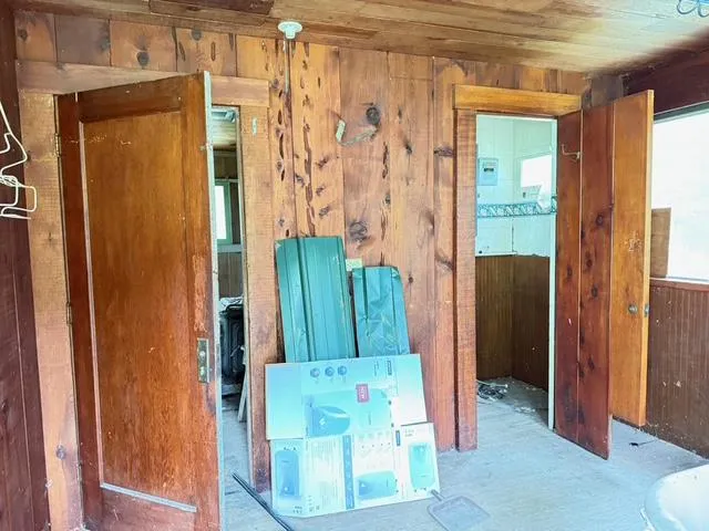 a bathroom with a tub and shower