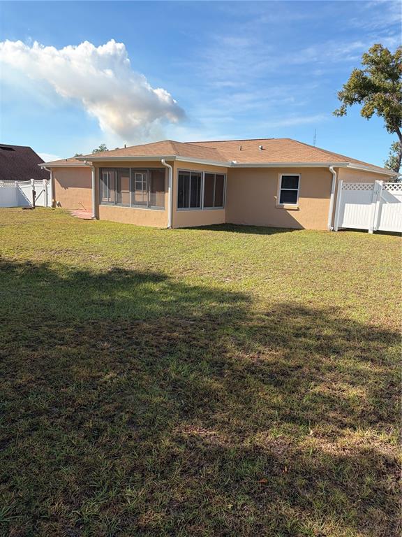 15405 Southwest 43rd Avenue Road Ocala, FL 34473 - Photo 22 of 27 a view of a house with a big yard