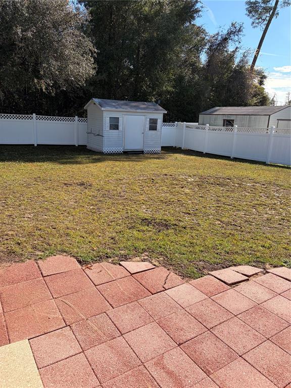 15405 Southwest 43rd Avenue Road Ocala, FL 34473 - Photo 27 of 27 a view of a terrace with a bench