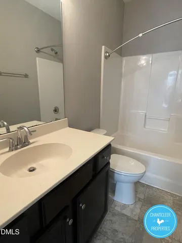 a balcony with wooden floor and yard in the back