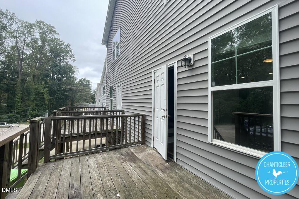 911 Chaney Road, Unit 100 Raleigh, NC 27606 - Photo 18 of 19 a view of a balcony with wooden floor and fence