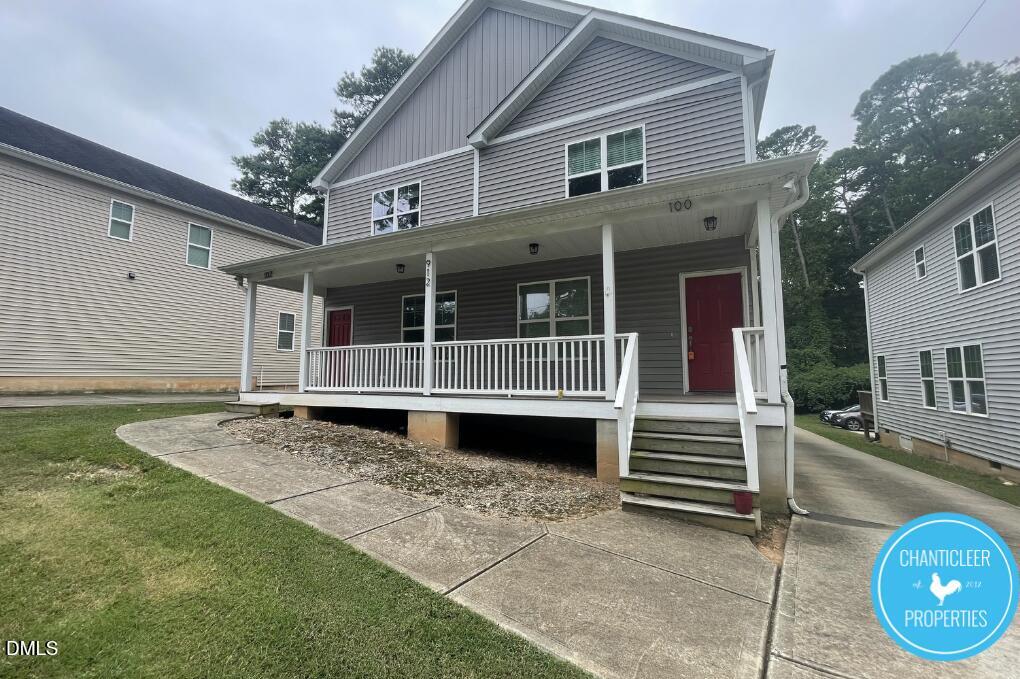 911 Chaney Road, Unit 100 Raleigh, NC 27606 - Photo 2 of 19 a view of a house with a window and wooden fence