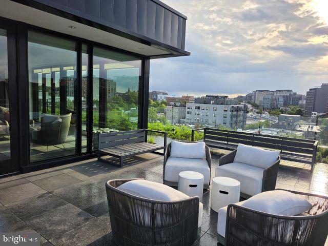 57 N Street Northwest, Unit 331 Washington, DC 20001 - Photo 15 of 18 a view of a patio with couches chairs and a table and chairs
