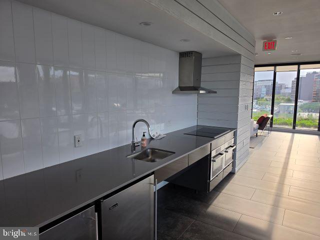 57 N Street Northwest, Unit 331 Washington, DC 20001 - Photo 16 of 18 a kitchen with granite countertop a sink and a stove top oven