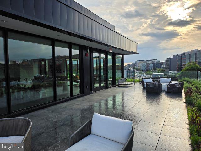 57 N Street Northwest, Unit 331 Washington, DC 20001 - Photo 17 of 18 a swimming pool with patio outdoor seating and city view