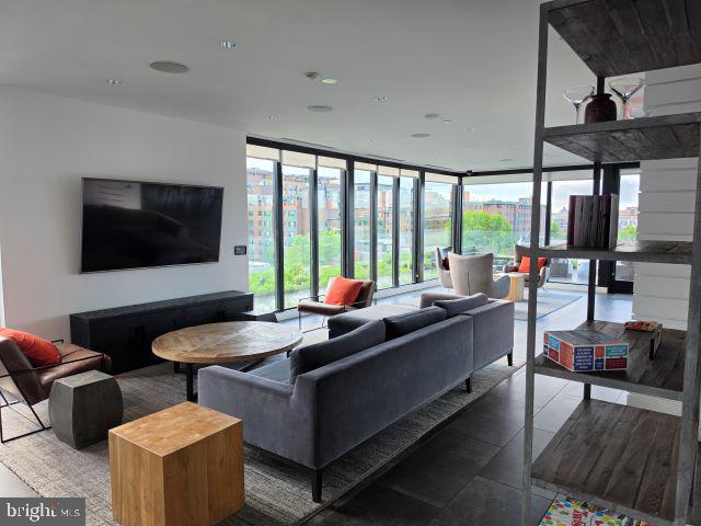 57 N Street Northwest, Unit 331 Washington, DC 20001 - Photo 18 of 18 a living room with furniture and a flat screen tv