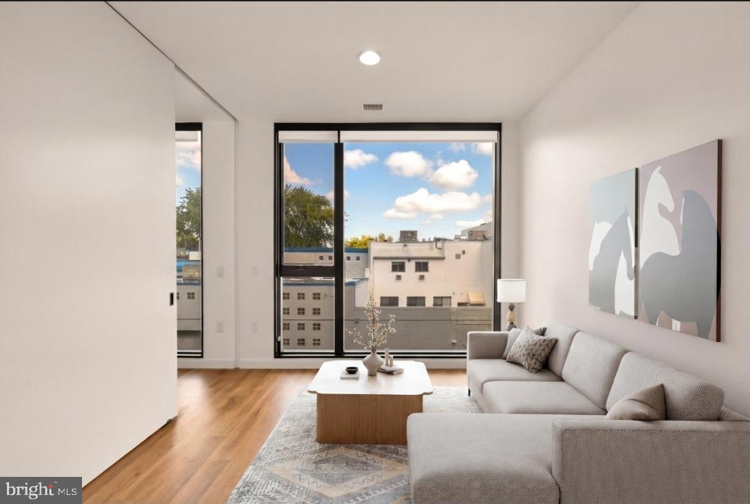 57 N Street Northwest, Unit 331 Washington, DC 20001 - Photo 3 of 18 a living room with furniture and large window