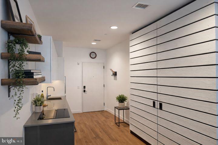 57 N Street Northwest, Unit 331 Washington, DC 20001 - Photo 5 of 18 a view of entryway and workspace