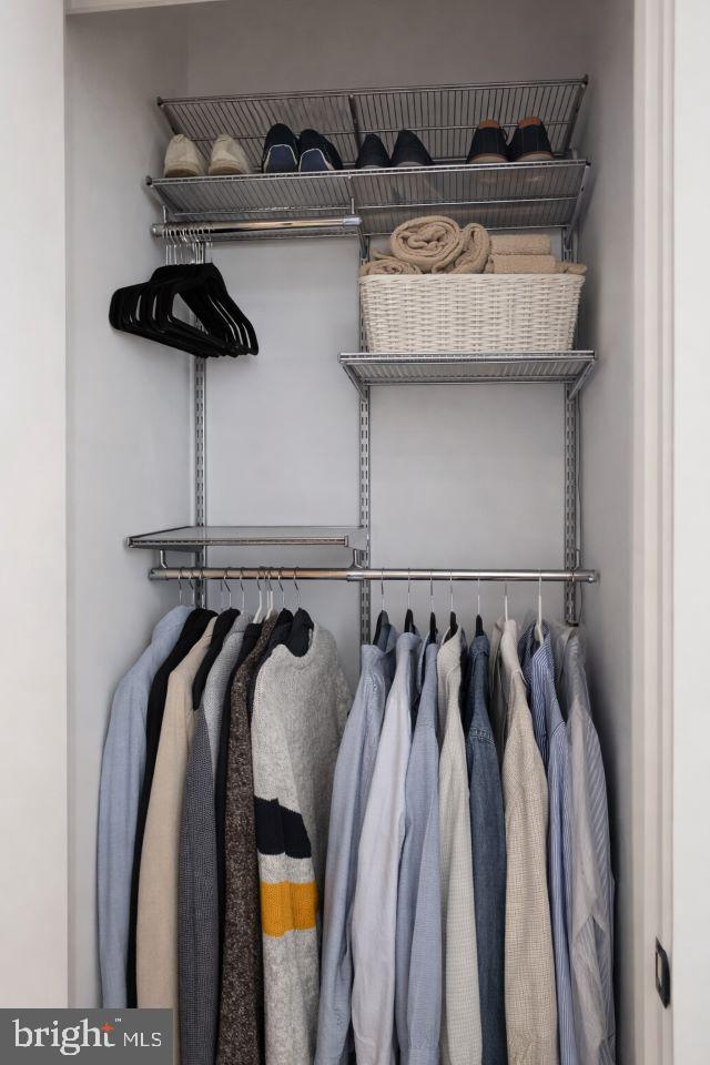 57 N Street Northwest, Unit 331 Washington, DC 20001 - Photo 8 of 18 a view of walk in closet with clothes and shoes