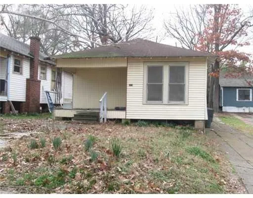 a house with trees in the background