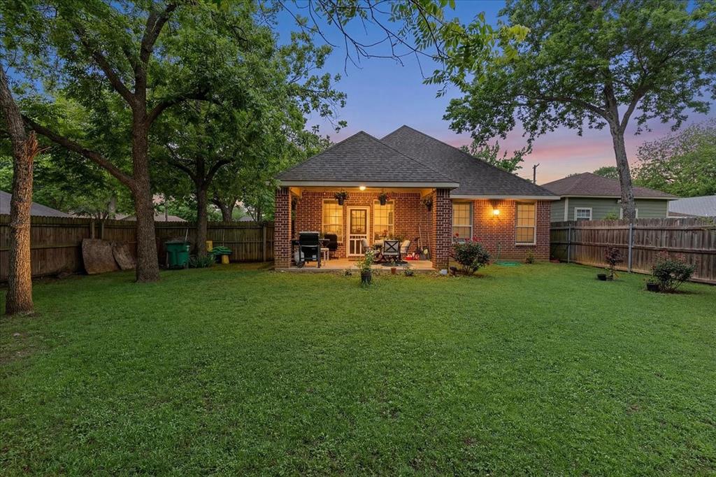 502 Ritchey Street Gainesville, TX 76240 - Photo 29 of 29 a front view of a house with garden
