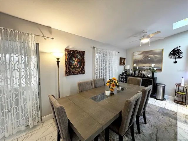 a kitchen with stainless steel appliances kitchen island a refrigerator sink and stove