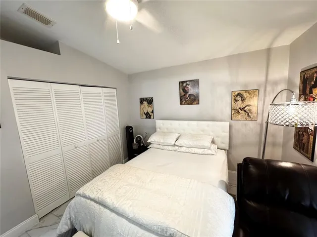 a bathroom with a sink a rug and a mirror