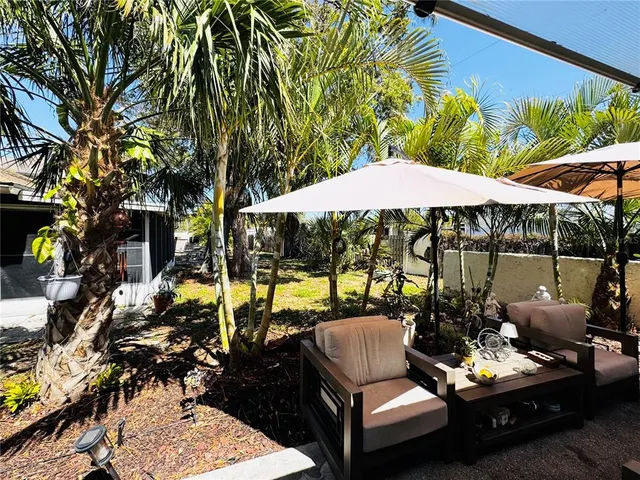a view of a chairs and table in a patio