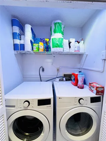 a living room with furniture and a glass door