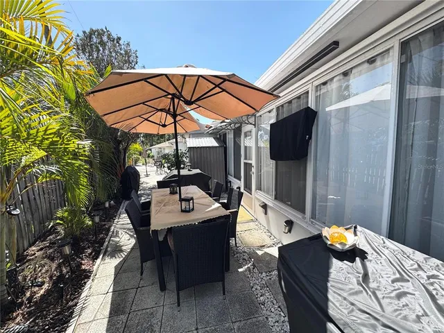 a view of a tables and chairs in the patio