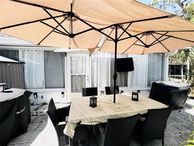 a view of a terrace with sitting area