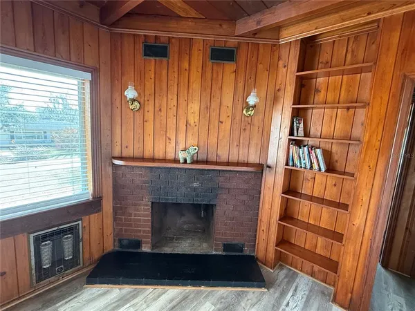 a view of a livingroom with furniture and a fireplace