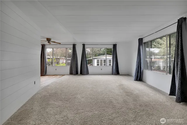 a view of a big room with large windows