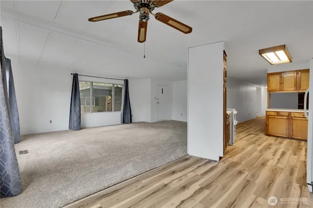 a view of a kitchen with a sink and cabinet area
