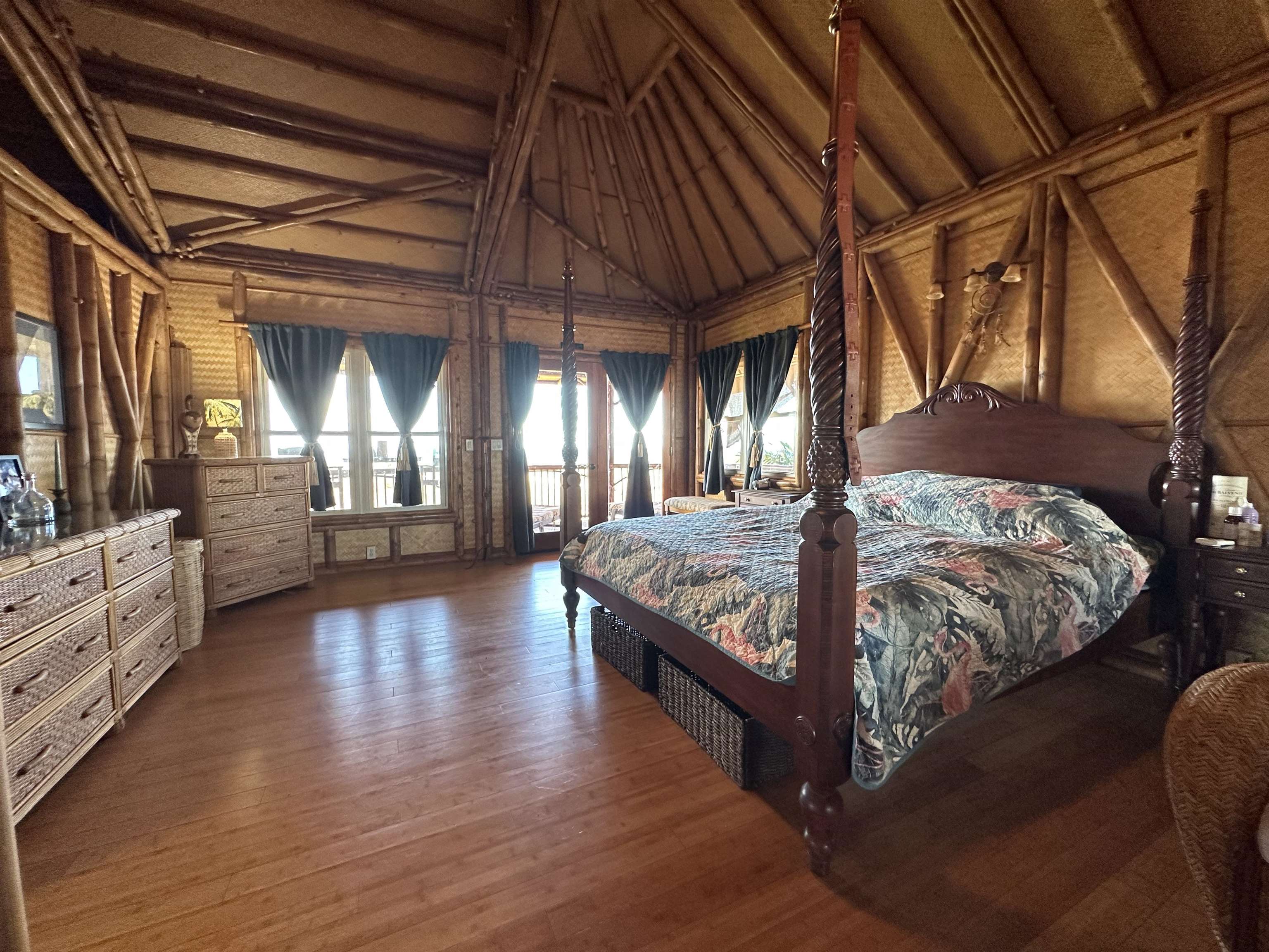 206 Awawa Road Maunaloa, HI 96770 - Photo 8 of 28 a bed sitting in a bedroom next to a window