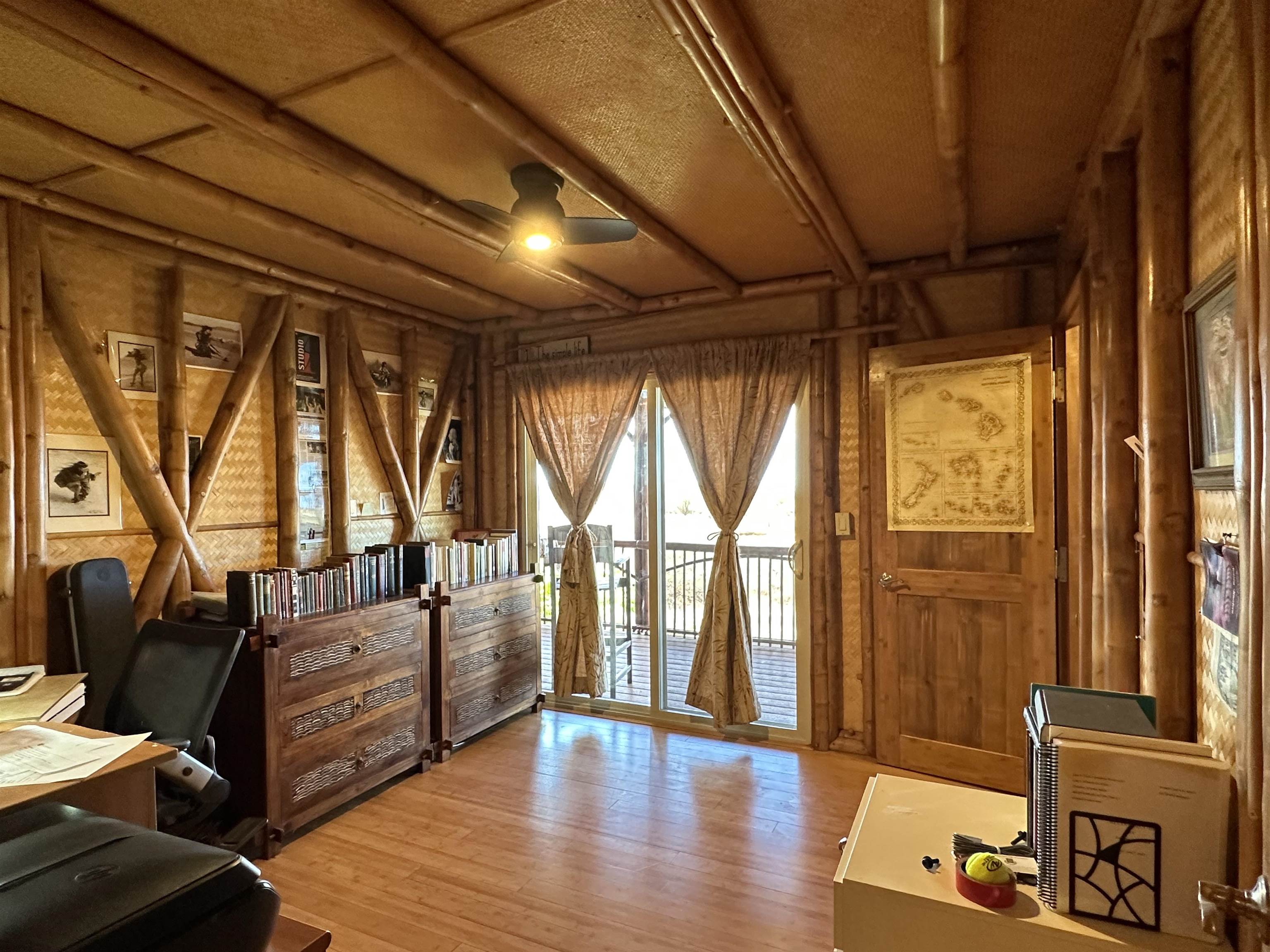 206 Awawa Road Maunaloa, HI 96770 - Photo 9 of 28 a living room with furniture and large windows