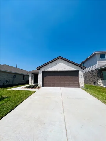a house with yard in front of it