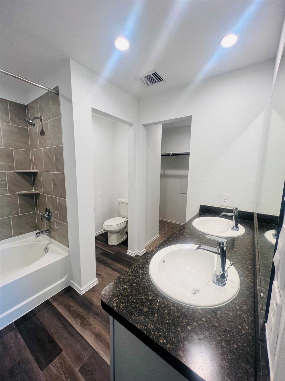 5215 Mossdale Bluff Ln Spring Spring, TX 77373 - Photo 12 of 25 a bathroom with a granite countertop sink toilet and shower