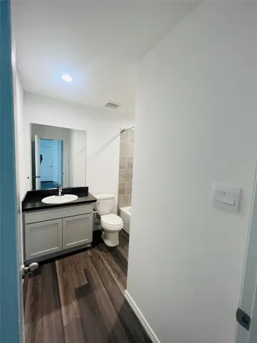a room with a sink and a mirror