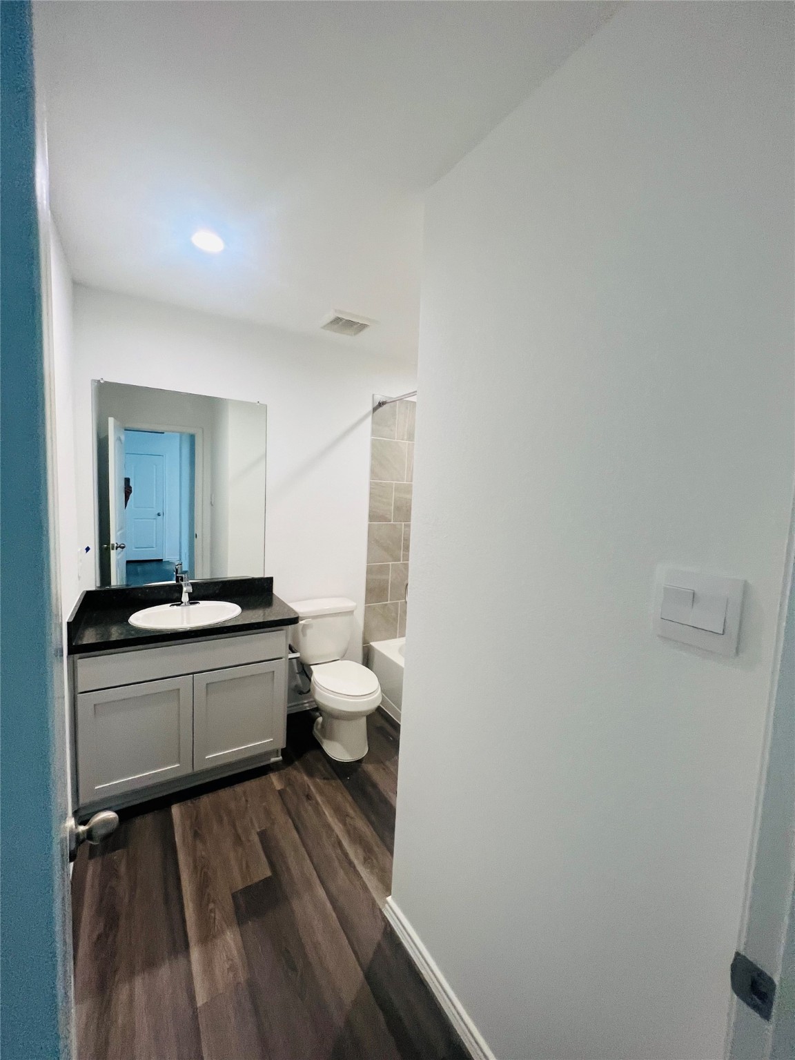 5215 Mossdale Bluff Ln Spring Spring, TX 77373 - Photo 6 of 25 a room with a sink and a mirror