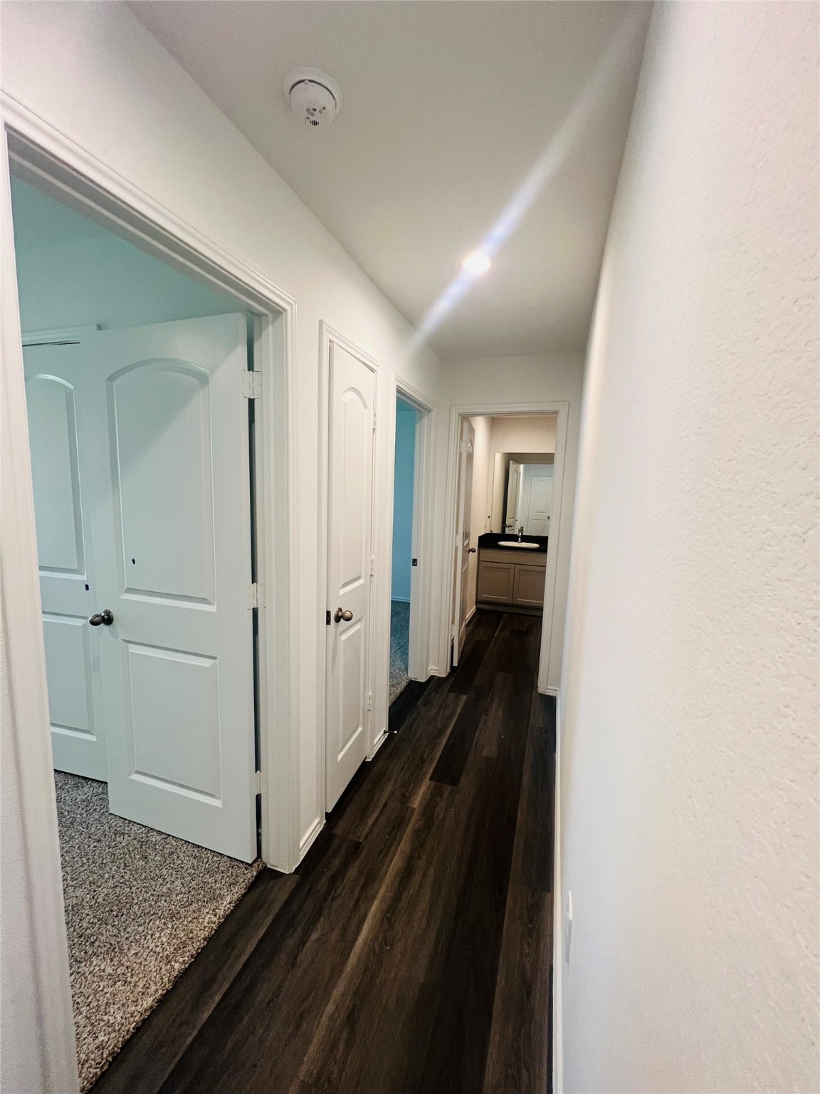 5215 Mossdale Bluff Ln Spring Spring, TX 77373 - Photo 7 of 25 a view of hallway with wooden floor