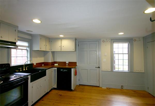 29 River Road Wayland, MA 01778 - Photo 5 of 18 a kitchen with stainless steel appliances granite countertop a sink stove and refrigerator