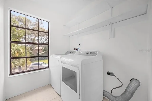 a utility room with dryer and washer