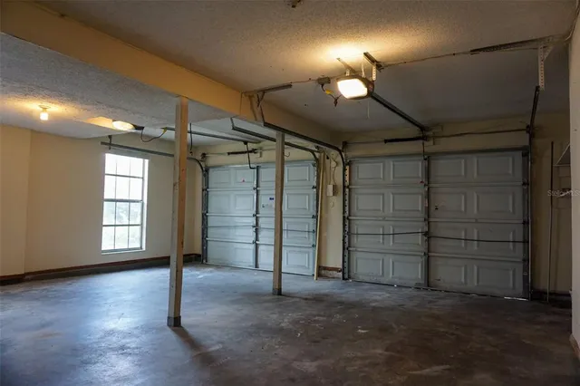 an empty room with a empty space and windows