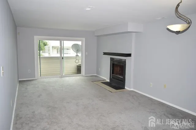 an empty room with fireplace