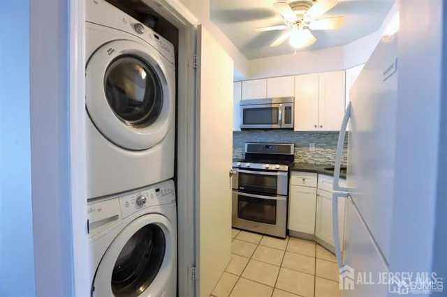 a kitchen with a washer and dryer