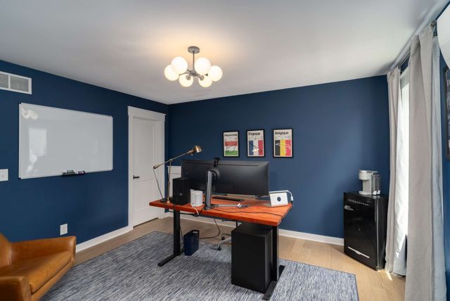 a room with furniture a rug and a window