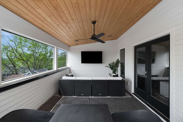 a view of a living room and a balcony