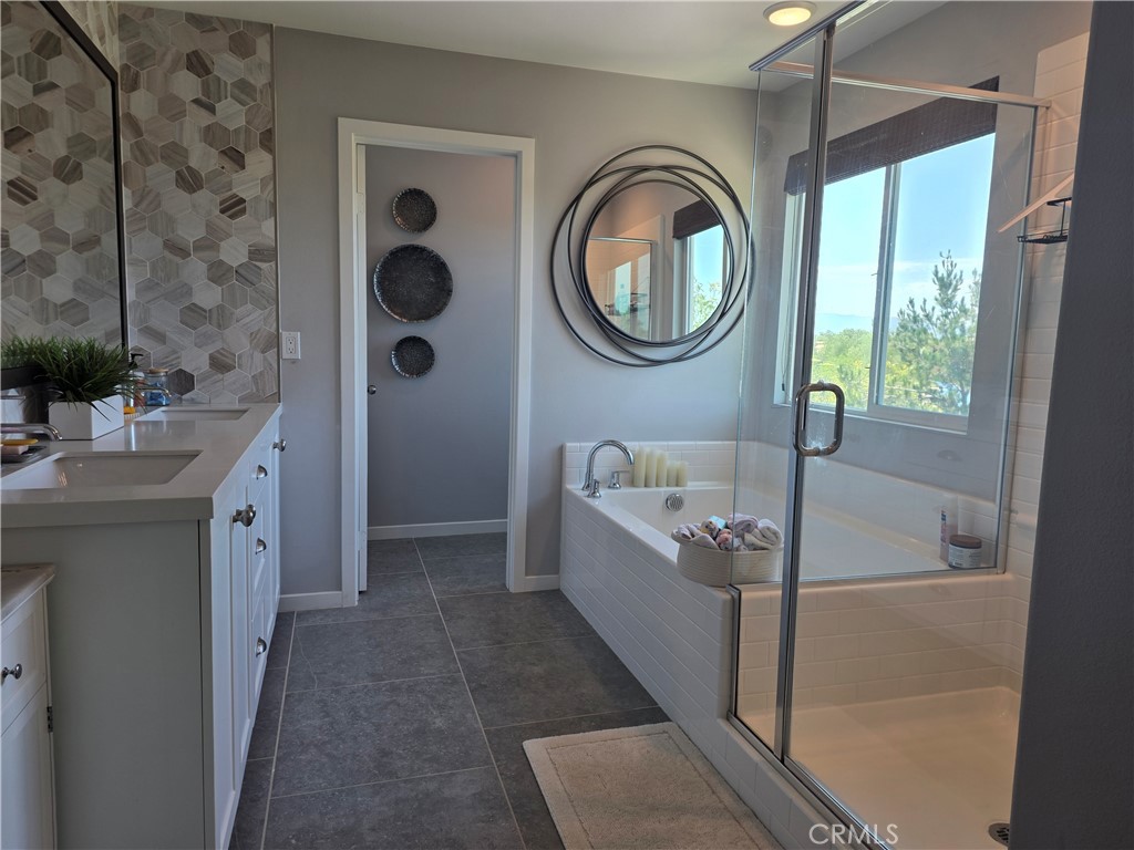 30835 Nature Road Murrieta, CA 92563 - Photo 28 of 44 Quartz counters, double sink, and custom tile accent wall