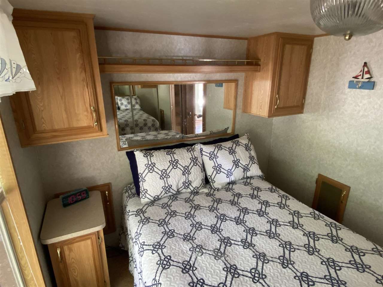 516 Highway 9 Marmora, NJ 08223 - Photo 2 of 28 a bed sitting in a bedroom next to a window