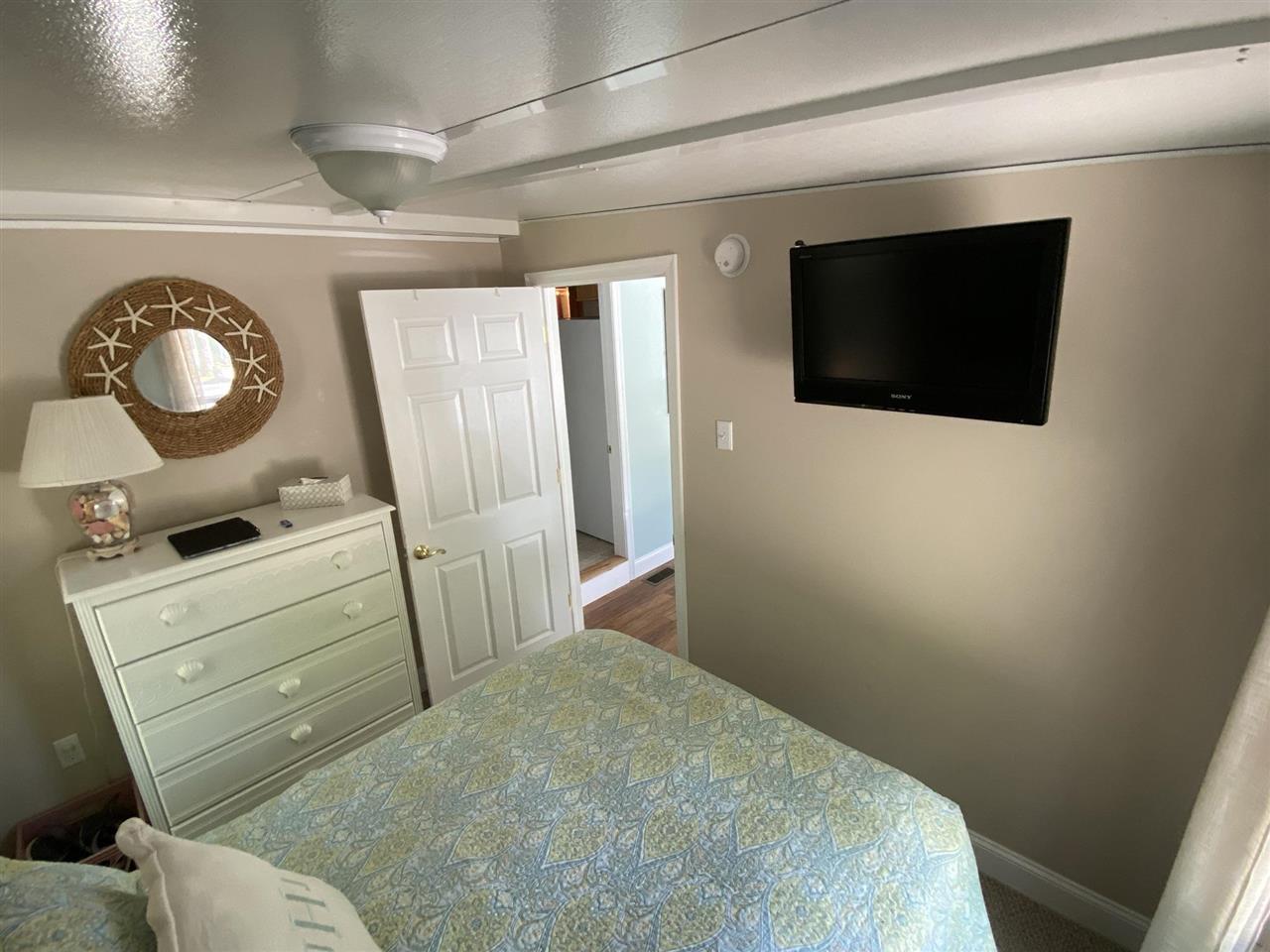 516 Highway 9 Marmora, NJ 08223 - Photo 14 of 28 a bathroom with a toilet sink and mirror