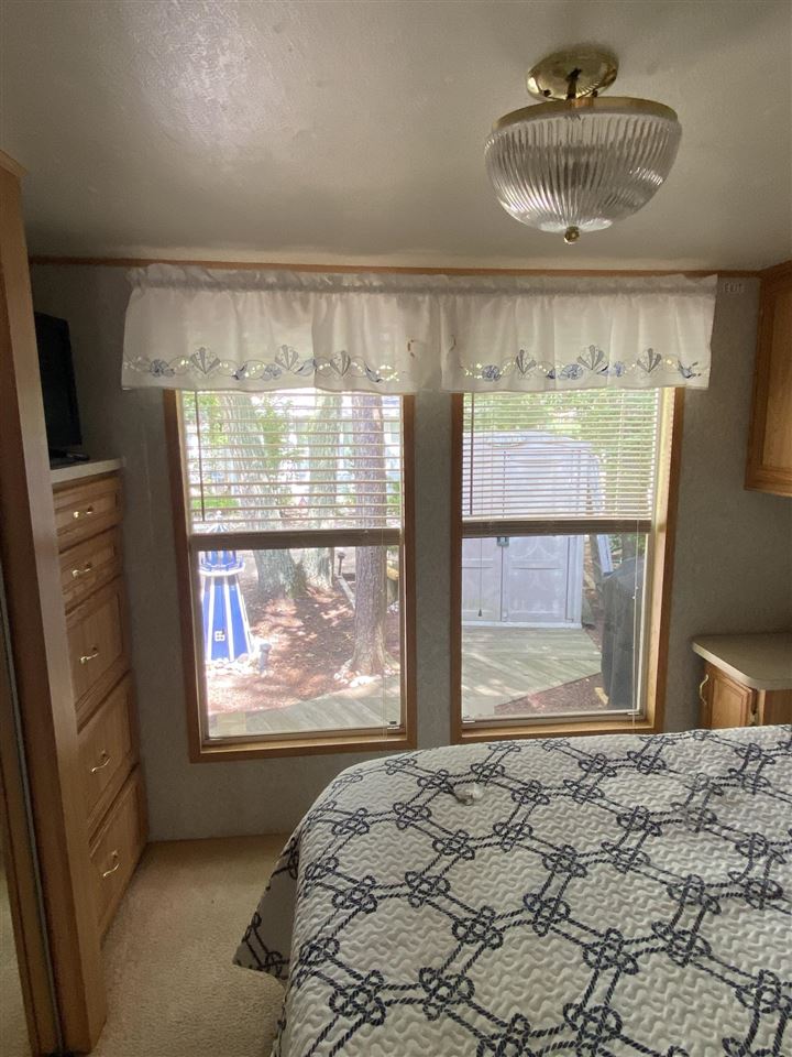 516 Highway 9 Marmora, NJ 08223 - Photo 3 of 28 a bedroom with a bed and a window