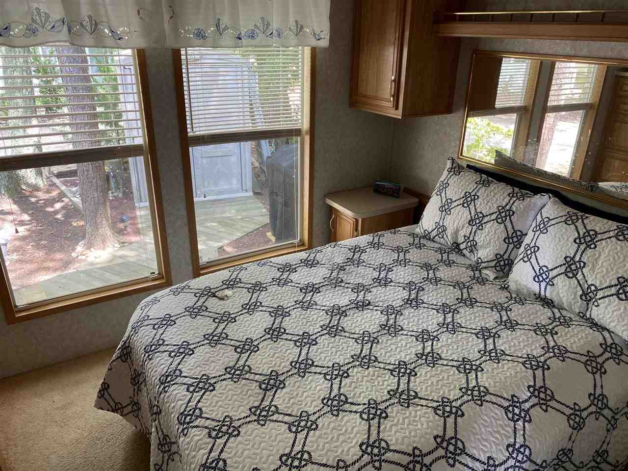 516 Highway 9 Marmora, NJ 08223 - Photo 24 of 28 a bed sitting in a bedroom next to a window