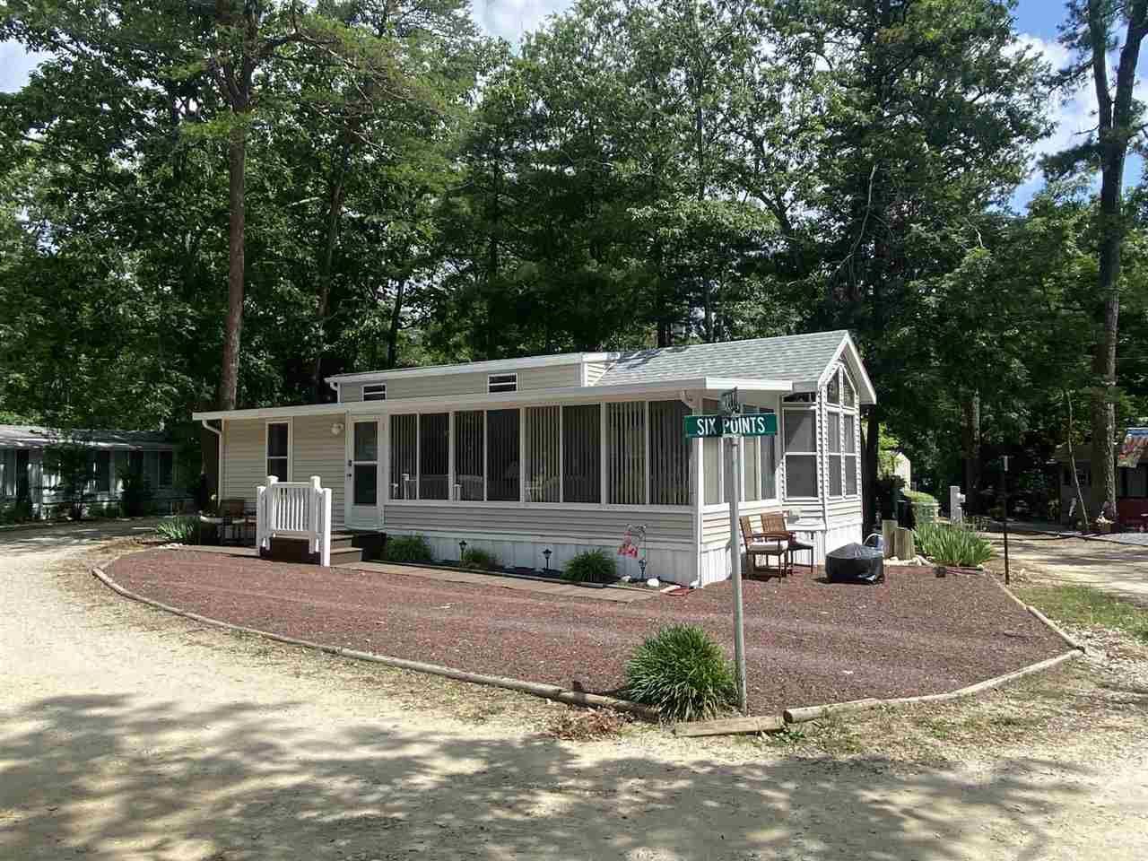 516 Highway 9 Marmora, NJ 08223 - Photo 28 of 28 a view of a house in the middle of a yard