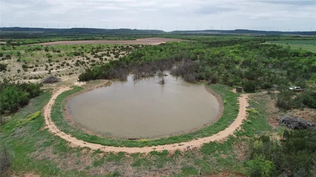 a reading room with furniture and a window